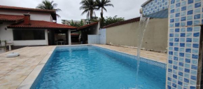 Casa piscina pé na areia Indaiá